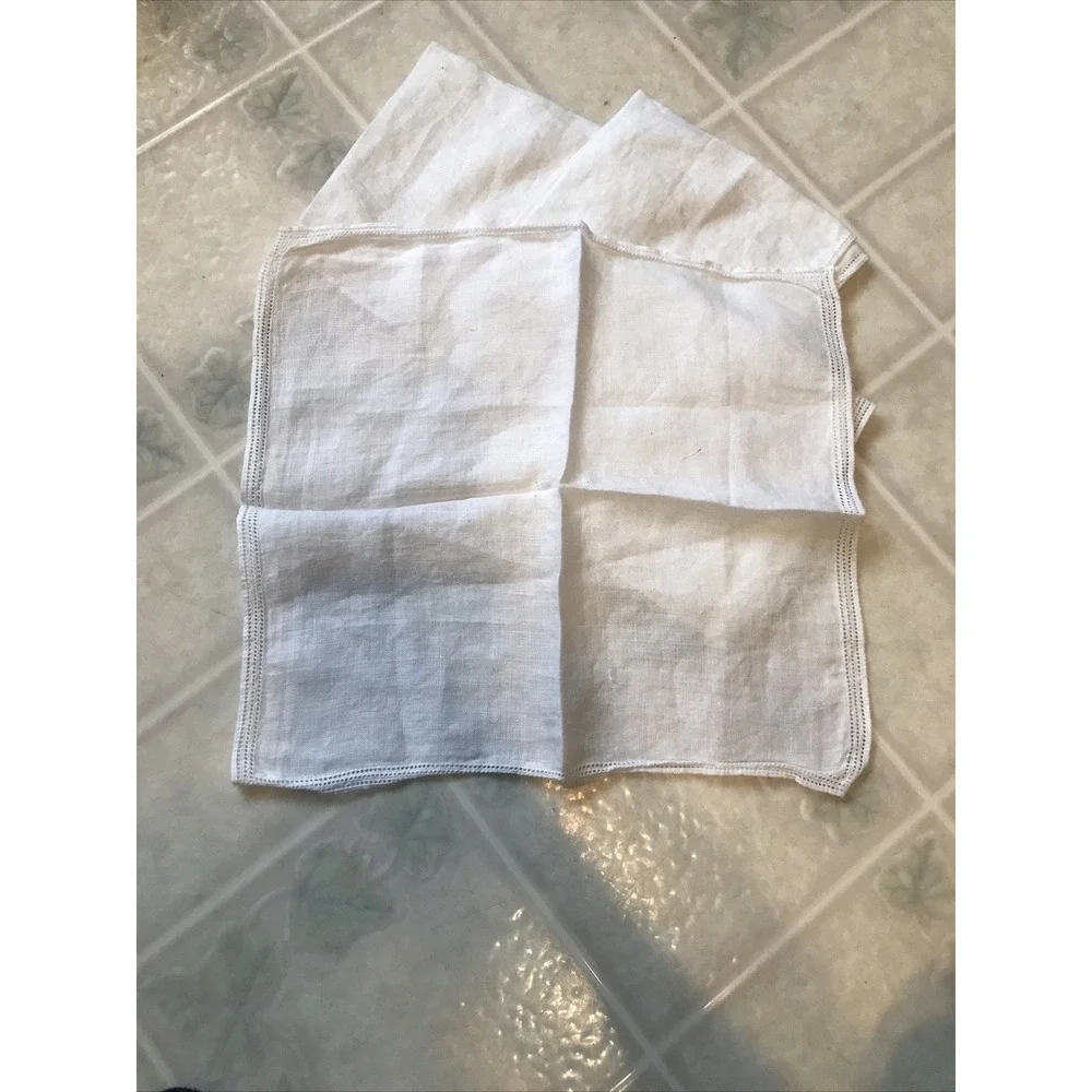 Set of Four White Linen Like Punched Pattern Napkins Delicate Edging